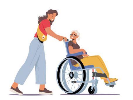 Companion assisting young client by pushing wheel chair